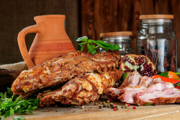Steak on ribs,baked and served with color chili pepper. Wooden rustic background. Top view.