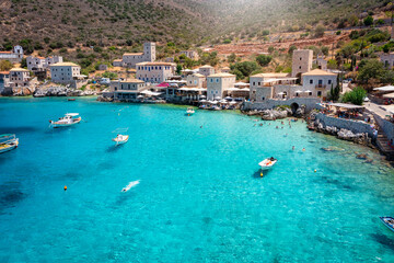 Fototapeta na wymiar The beautiful village Limeni on the south Mani coast, Peloponnese, Greece, with shining, turquoise sea during summer time