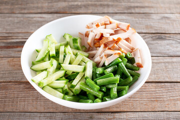 Healthy salad with green beans, chicken and cucumber.