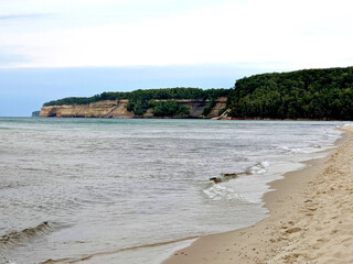 Lake Superior beach line with Pictured rocks in background