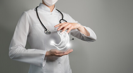 Unrecognizable doctor holding highlighted handrawn Stomach in hands. Medical illustration,...