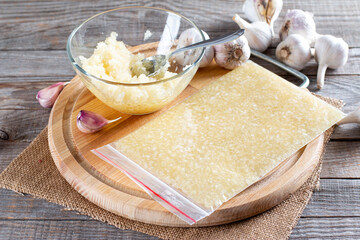 Frozen garlic. Frozen garlic puree on table. Frozen food Concept