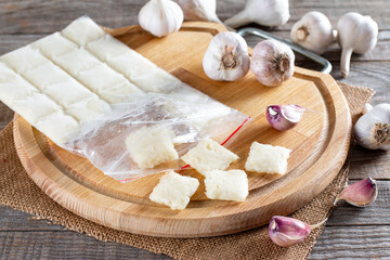 Frozen garlic. Frozen garlic puree on table. Frozen food Concept