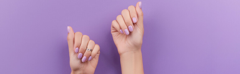 Womans hands with trendy lavender manicure. Spring summer nail design