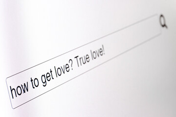 Search bar on a computer monitor with the question How to get true love. Searching for information...