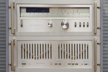 An analog stereo tuner and an analog stereo equalizer installed in a retro hardware rack.