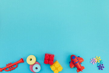 Background with plastic kids toys with copy space