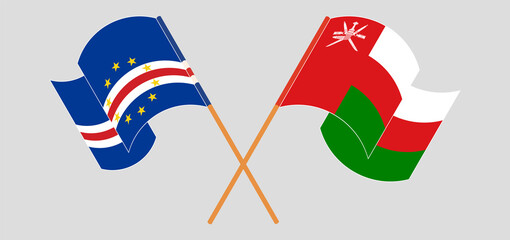 Crossed and waving flags of Cape Verde and Oman