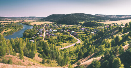 landscape with mountains, village and river