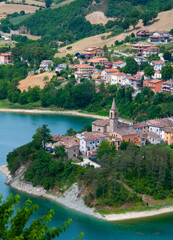 Fototapeta na wymiar Beautiful landscape of small old town with beautiful lake MERCATALE MARCHE ITALY AT SUMMER
