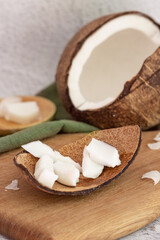 Open coconut, coconut pieces on the shell