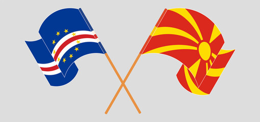 Crossed and waving flags of Cape Verde and North Macedonia