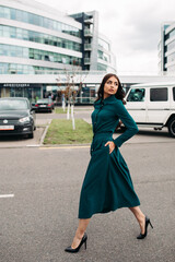 Fototapeta premium Photo full-length girl in a beautiful dress with a length below the knee