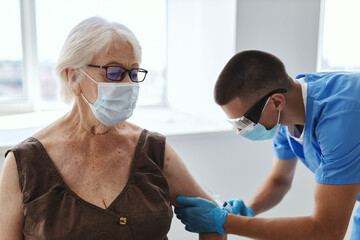 elderly woman patient in hospital vaccine passport healthy immunity