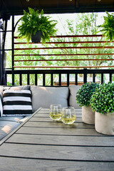 Sheltered outdoor covered deck for relaxing summer afternoon and evenings with glass or wine during...