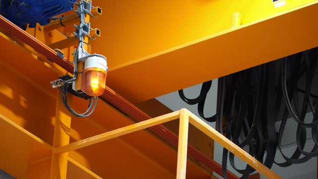 Footage 4K: ellow orange siren light rotary warning light in industrial side safety sign