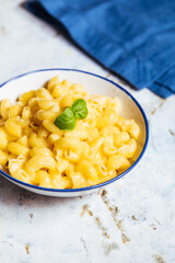 Mac and cheese on a white rustic board