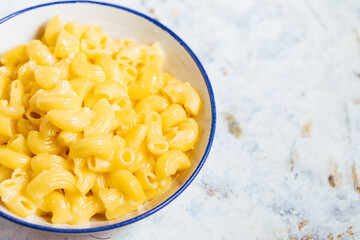 Mac and cheese on a white rustic board