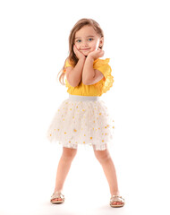 portrait of cute little toddler girl in fashionable dress isolated on white background
