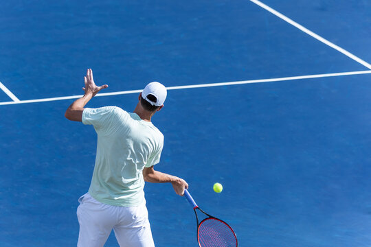 tennis player on blue hard court