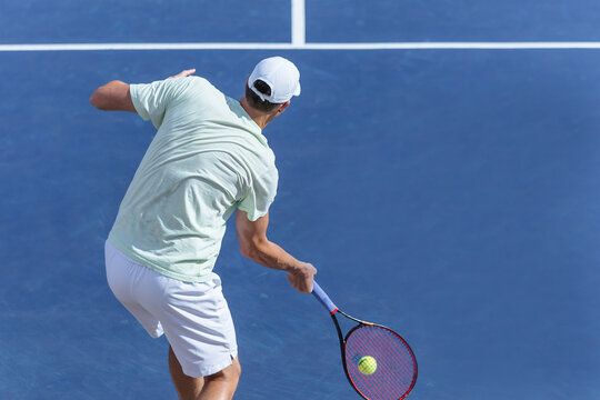 tennis player on blue hard court
