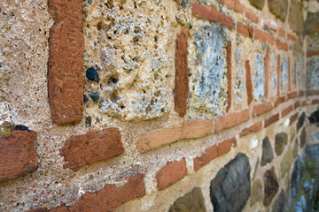 Close up of an old monastary wall, orange brick pattern