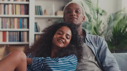 Close up of peaceful beautiful millennial Indian woman embrace sleep on African American man lover shoulder, happy biracial couple hug cuddle enjoy romantic intimate moment together at home. - Powered by Adobe