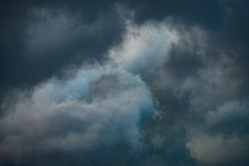 Dense rain clouds are gathering in the sky