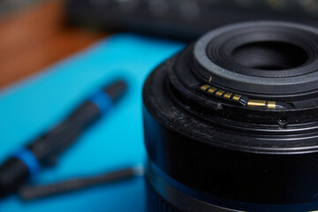 Fototapeta na wymiar Photo lens with electrical contacts closeup shot closeup
