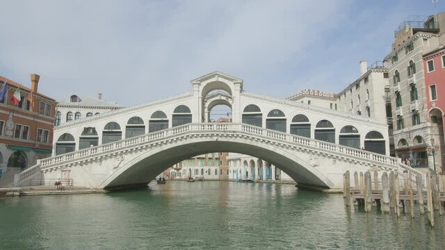 Tilt-up during the passage under the Rialto bridge with detail on the male head in keystone of the external central arch of the bridge