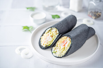 Crab meat lettuce lettuce cheese black tortilla