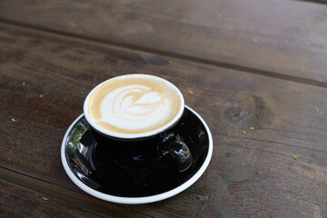 black cup of coffee on a table