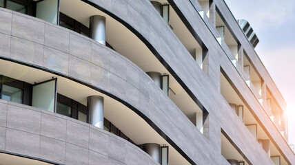 Detail of a modern high-rise apartment building in glass and steel. Detailed pictures of exterior urban architecture.