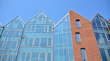 Detailed view of modern townhouses in row of. Original townhouses in a residential area. Buildings predominantly made of glass, steel and concrete.
