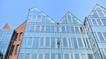 Detailed view of modern townhouses in row of. Original townhouses in a residential area. Buildings predominantly made of glass, steel and concrete.