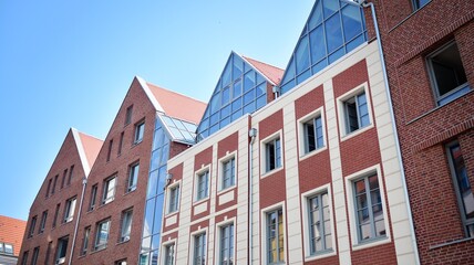 Detailed view of modern townhouses in row of. Original townhouses in a residential area. Buildings predominantly made of glass, steel and concrete.