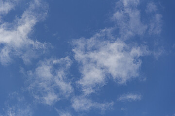 Obraz premium white clouds on a blue sky for background