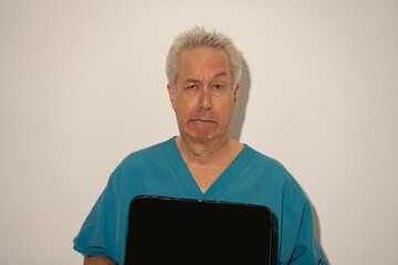 Doctor or nurse mug shot on a white wall