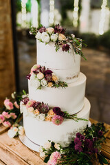 Pretty three-tier wedding cake decorated for a wedding event.