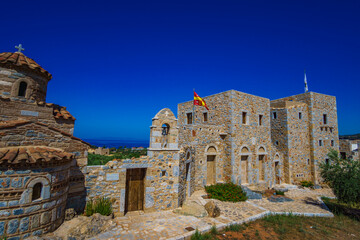 Fototapeta na wymiar Greek traditional old Orthodox Church and architectural stoned buildings near coastal Mani in Mesenia - Greece