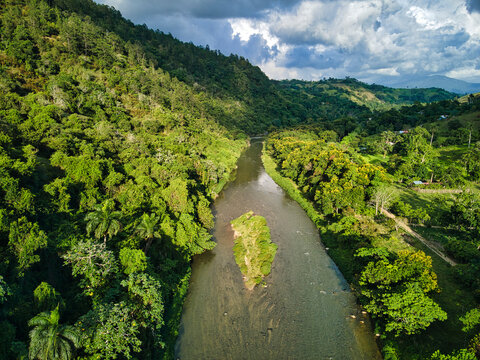 Rio Yaque del Norte from above around wildlife and nature, with an island in it, Jarabacoa, Dominican Republic