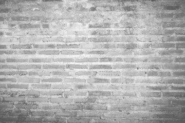 light shines on modern black brick wall texture for black retro background, Old brick wall texture shabby grunge texture weathered stained old stucco black and painted black brick wall for background.