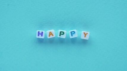 happy text optimism message cubes letters blue - Powered by Adobe