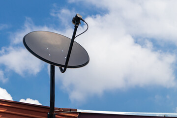 Satellite dish on roof to receive a TV signal