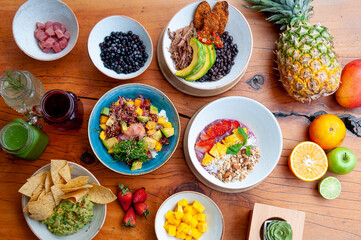 Healthy food plates with overhead view on wooden table