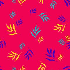 Seamless pattern of colorful tropical leaves