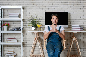 Young hipster beard Asian man happy in his new modern minimal startup office, concept for happy businessman at beginning