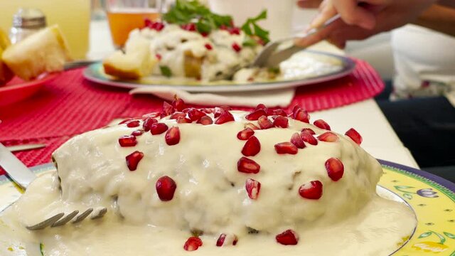 Traditional mexican food called "Chile Poblano" with pomegranate seeds
