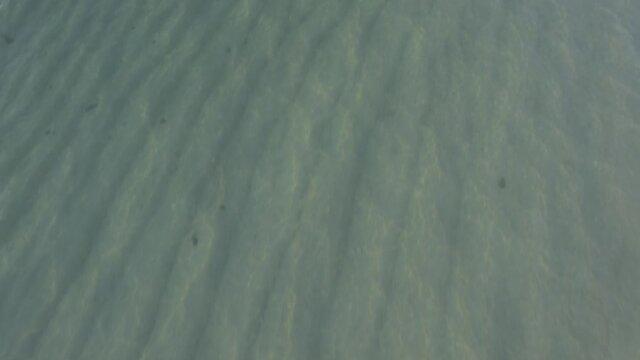 Aerial Drone of Beautiful Crystal Clear Water Geger Beach in Bali Indonesia