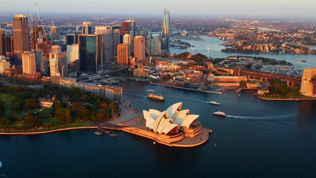 Aerial View of Sydney CBD and Opera House with many Ferry Ships near Circular Quay in the Morning - NSW Australia